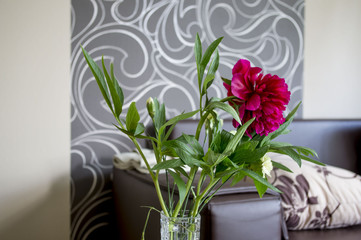 Lilies in a vase on the table.