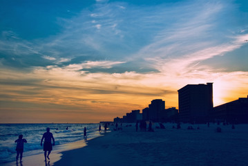 Fototapeta na wymiar Sunset Destin Florida USA With People Walking on the Beach