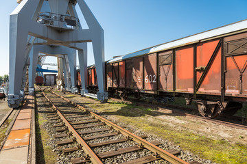 Historical harbor cranes and railway carriage of the exterior area of the Hamburg port museum at...