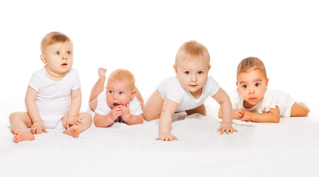 Cute babies crawl in a row wearing white bodysuit