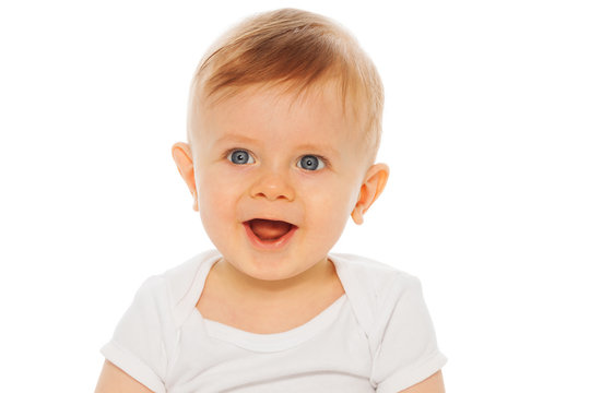 Portrait of nice laughing baby in white bodysuit