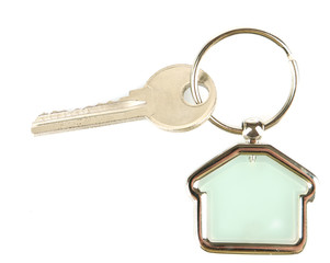 Keys with trinket on light background