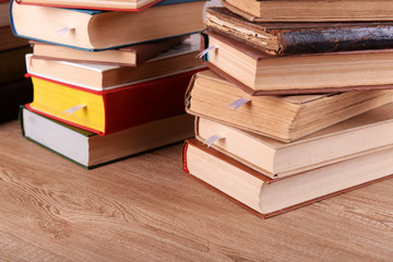 Stacks of books on table close up
