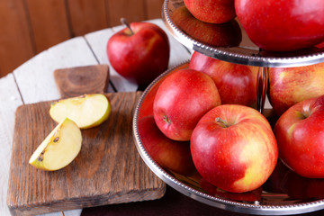 Tasty ripe apples on serving tray on table close up