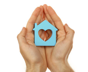 Fototapeta premium Female hands holding house isolated on white