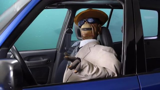 Puppet Monkey Driving Underwater.