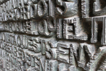 Metal Words Background on Sagrada Familia Door, Barcelona, Spain

