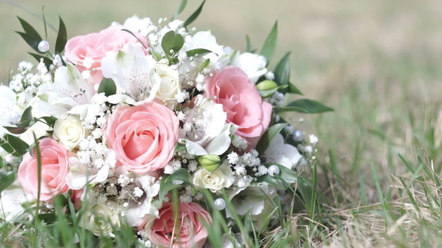 Wedding Bouquet On The Green Grass. Slider Shot