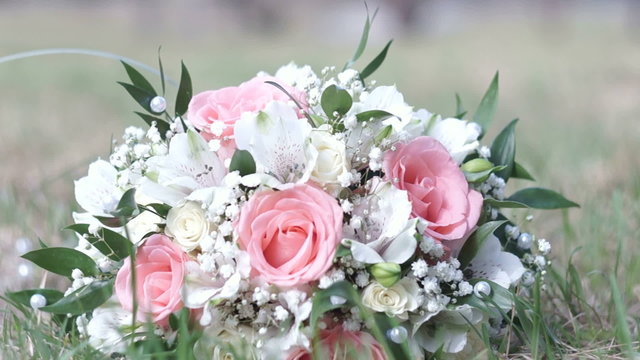 Wedding Bouquet On The Green Grass. Slider Shot