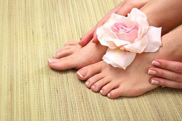 Obraz na płótnie Canvas Beautiful feet with perfect spa french nail pedicure