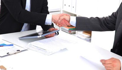 Business people shaking hands, finishing up a meeting