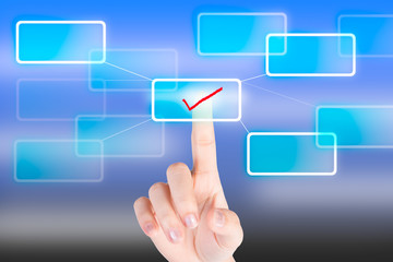 Hand pressing tick symbol  button with technology background