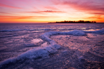 Fototapeta na wymiar Winter landscape with sunset fiery sky.