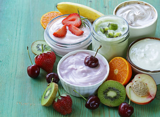 assortment of different yogurt for breakfast with berries 