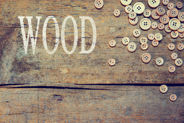 Holz Hintergrund mit Knöpfen und dem Wort Wood