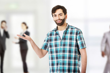 Young man showing something on palm.