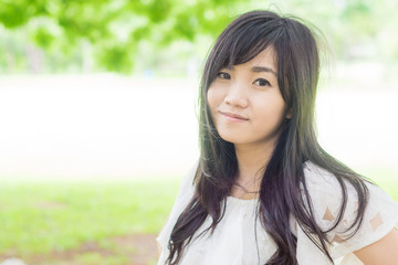 Fototapeta premium Young asian woman relaxing in the park