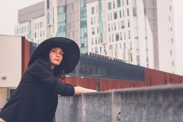 Beautiful girl posing in an urban context