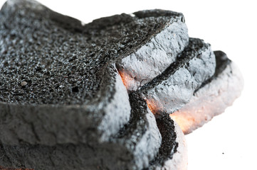 Closeup of three loafs of burnt bread