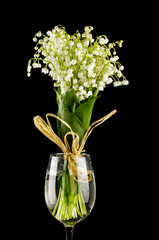 Lily-of-the-valley in the vase isolated on the black background