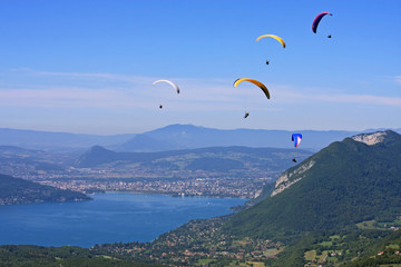 Paragiders above Lake Annecy