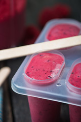 making homemade summer fruit lolly pops