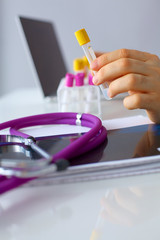 Test tube in doctor hand