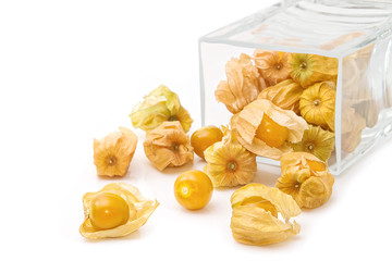 Cape gooseberry (physalis) in glass jar on white background