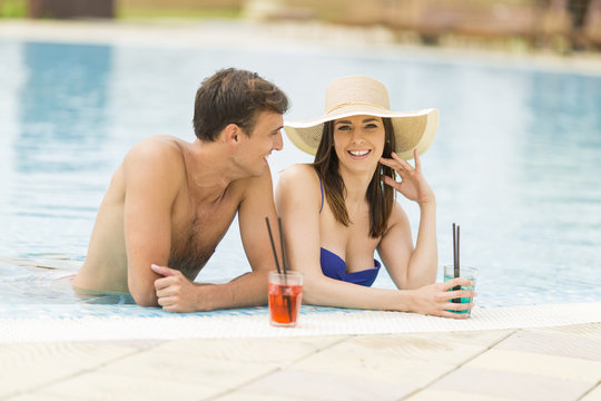 Young couple by the pool