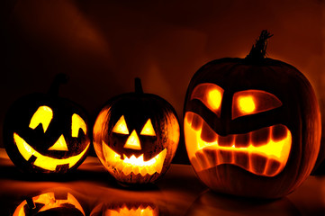 Halloween pumpkin head jack lantern with scary evil faces spooky