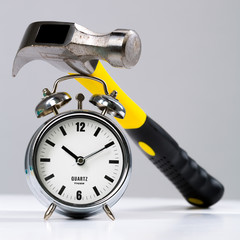 Conceptual Hammer Tool on a Round Alarm Clock