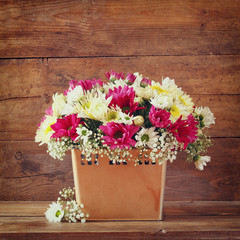 summer bouquet of flowers and on the wooden table