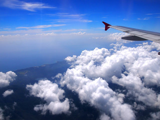 Fototapeta premium Airplane wing, view from window with beautiful sky