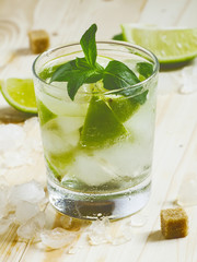 Fresh cocktail witn soda, lemon and mint, selective focus