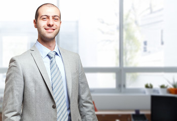 Smiling businessman in his office