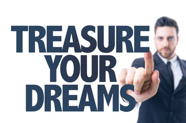 Business man pointing the text: Treasure Your Dreams