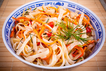 Asian rice noodle with chicken meat and carrots