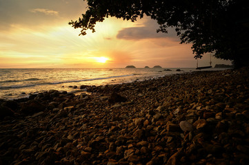 Dramatic sunset and sun beam at a sea in Thailand