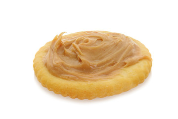 peanut butter on round cracker