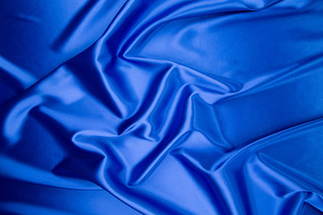 Blue silk cloth texture close up.