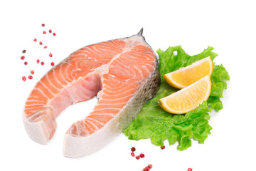 Raw salmon steak with lemon.