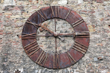 Rusty old clock on the wall