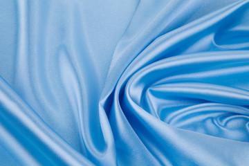 Blue silk cloth texture closeup.