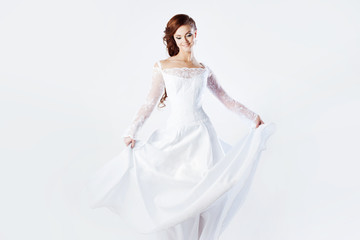 Fototapeta na wymiar Beautiful bride in wedding dress, white background, square