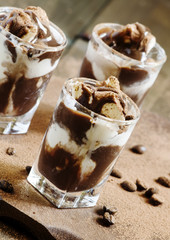 Dessert of ice cream and chocolate, decorated with cocoa and cof
