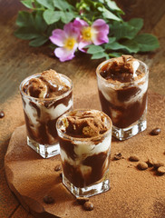 Dessert of ice cream and chocolate, decorated with cocoa and cof