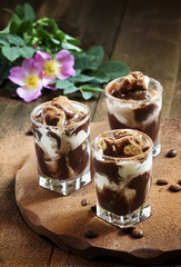 Dessert of ice cream and chocolate, decorated with cocoa and cof