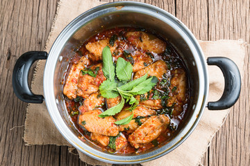 fried chicken with basil leaves