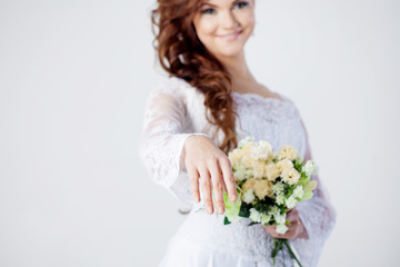 Naklejka premium The bride extends her hand, beautiful smiling woman in a wedding