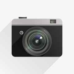 Camera in a flat design with realistic lens.